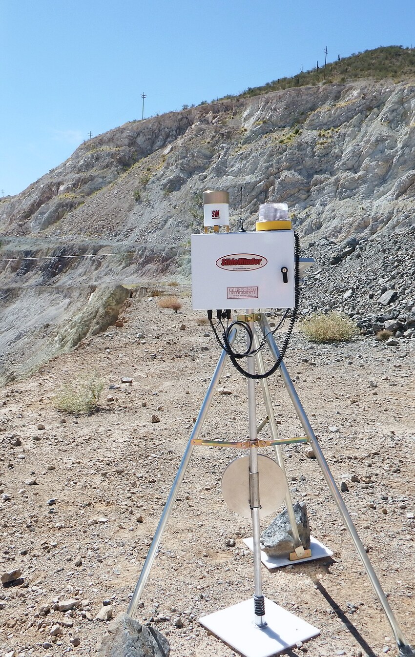 A slope-monitoring extensometer installed on an unstable rock face.